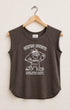 Brown sleeveless shirt with graphic design on a hanger against a beige background