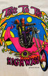 Close up of colorful chopper motorcycle graphic on front of Rat’s Hole Take To The Highway 1975 black and white raglan T-shirt.