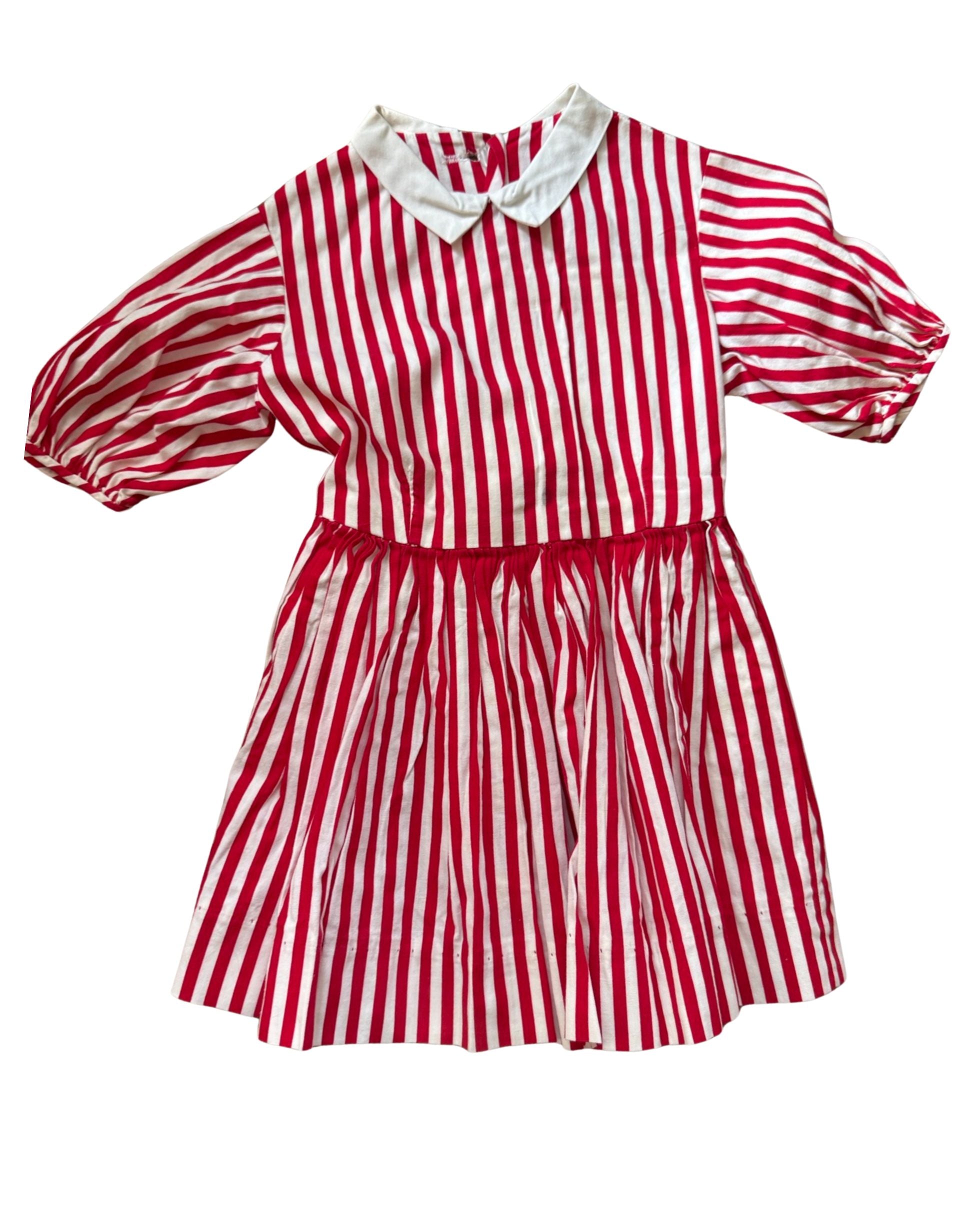 Red and white striped dress with a white collar on a white background
