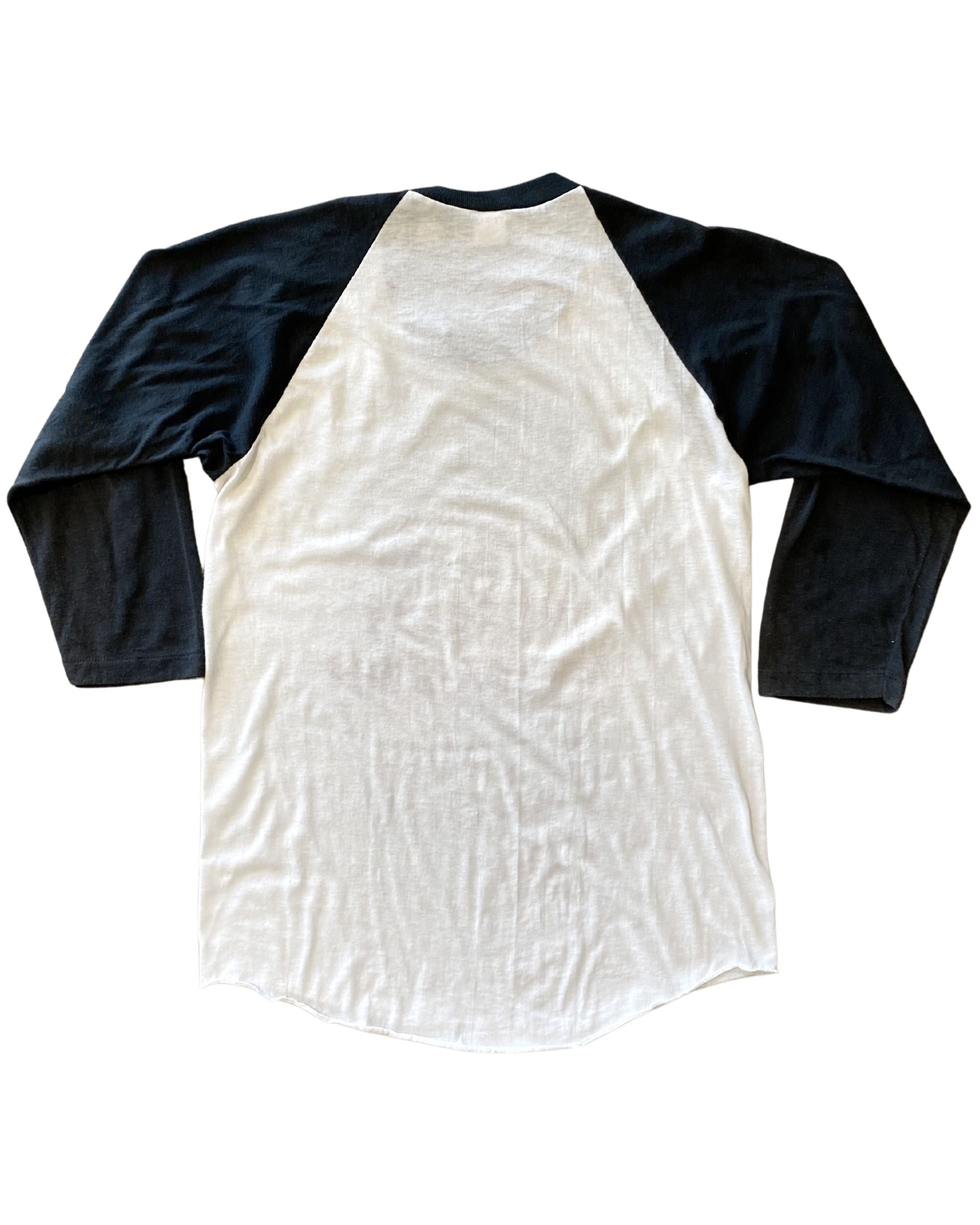 Back hem and sleeve details of black-and-white baseball tee.
