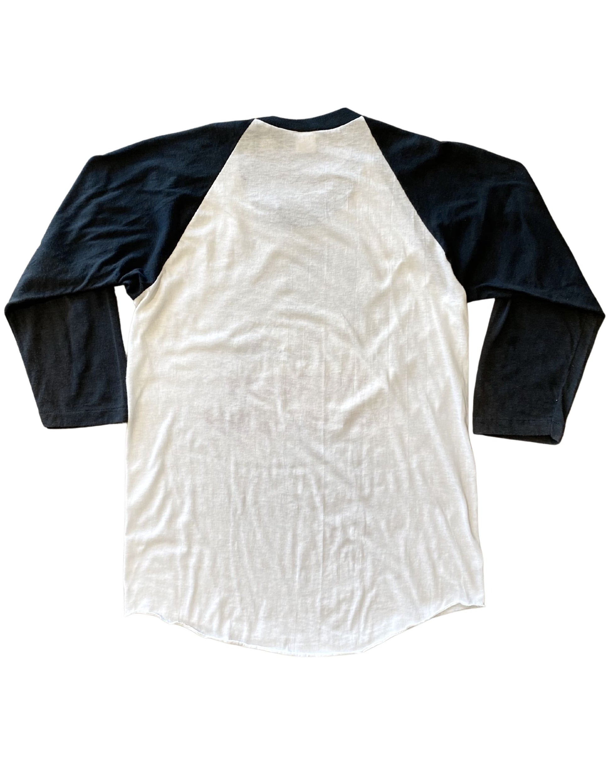  Back hem and sleeve details of black-and-white baseball tee.