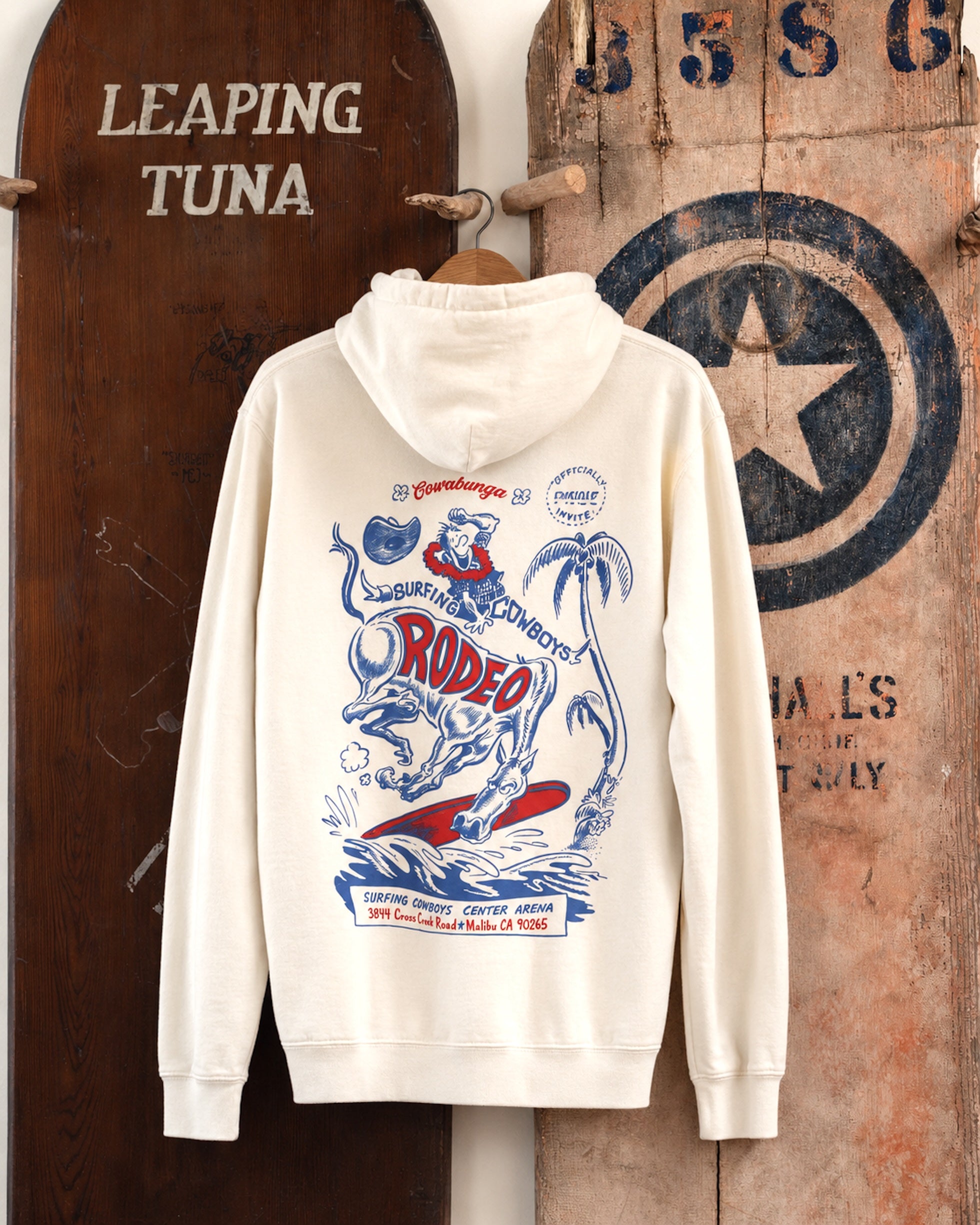Surfing Cowboys Rodeo pull-over hoodie in cream, back view with bucking horse surfing a wave graphic.
