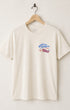 Front of Surfing Cowboys Rodeo cream colored t-shirt with chest placement colorful graphic on a hanger against a white background