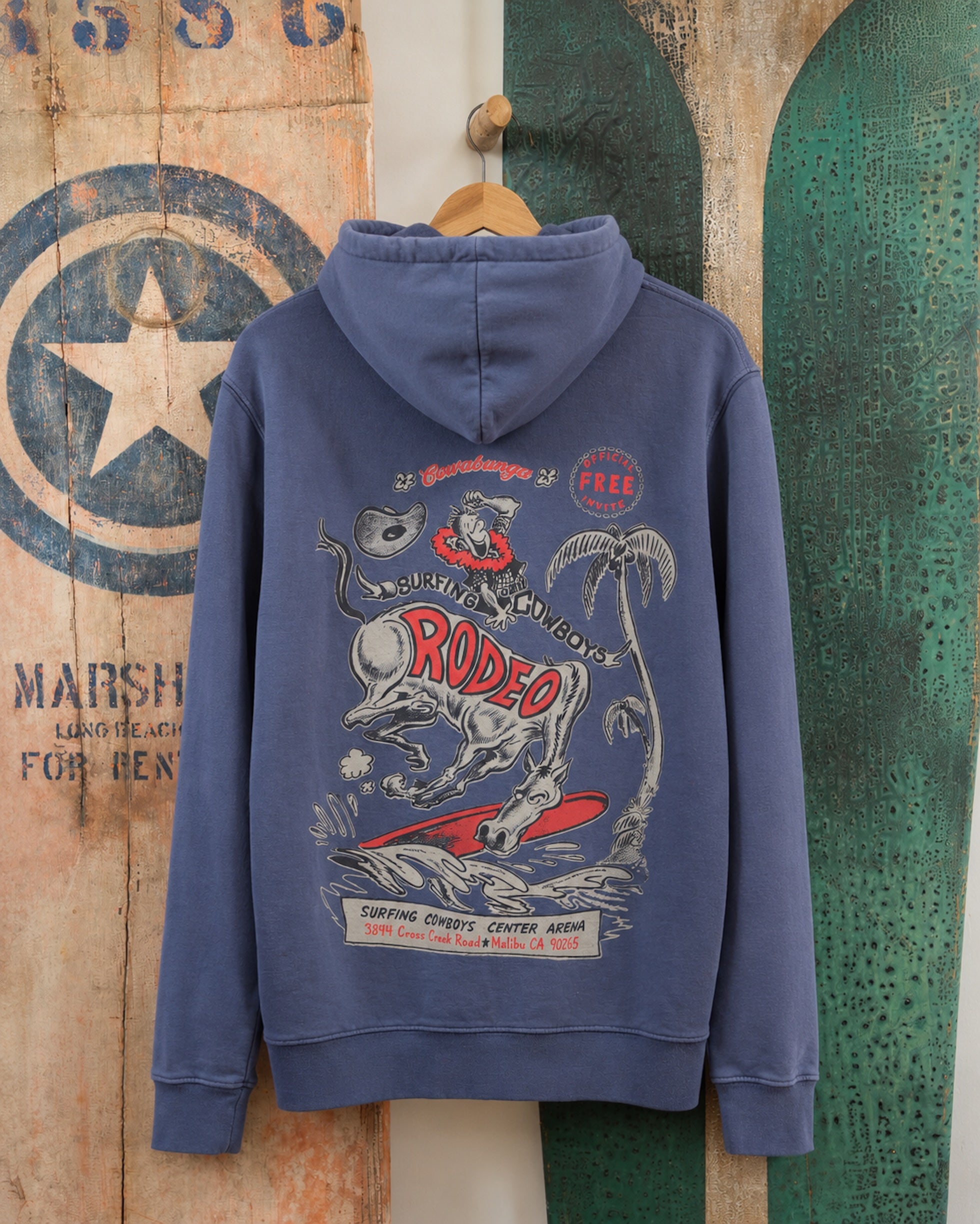 Surfing Cowboys Rodeo pull-over hoodie in washed navy, back view with bucking horse surfing a wave graphic.
