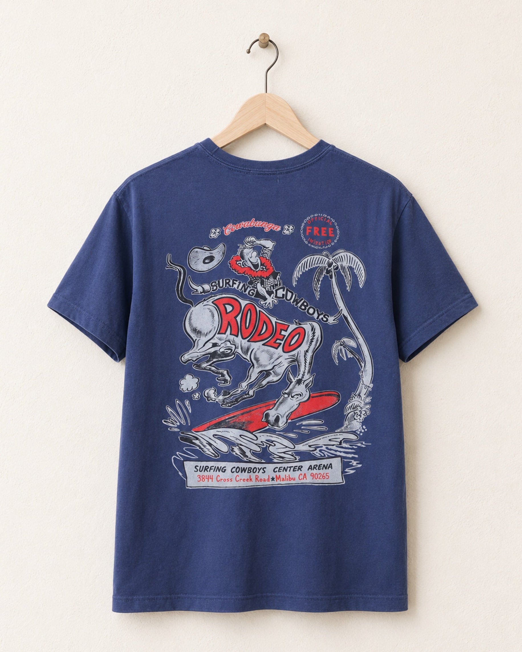 Blue t-shirt with rodeo graphic on a hanger against a white background