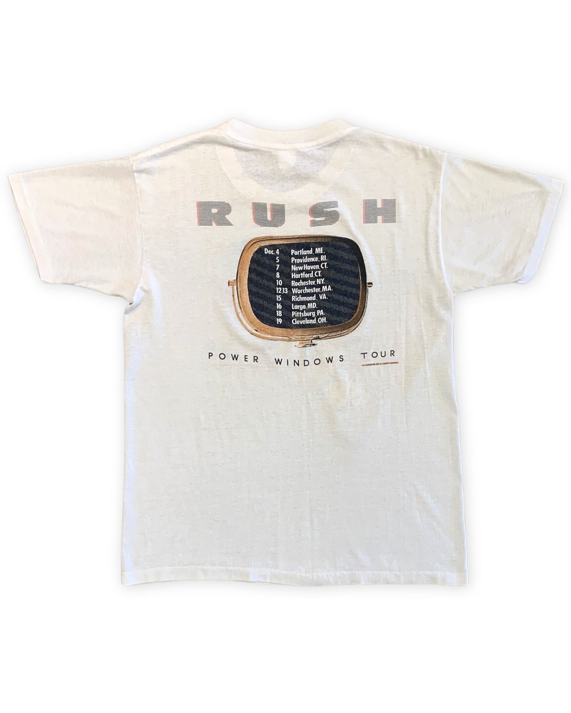 Back view of a white Rush Power Windows Tour T-shirt with a large RUSH logo, television-screen graphic, and printed December tour dates.