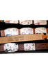 Detailed view of leather belts and personalized buckles.