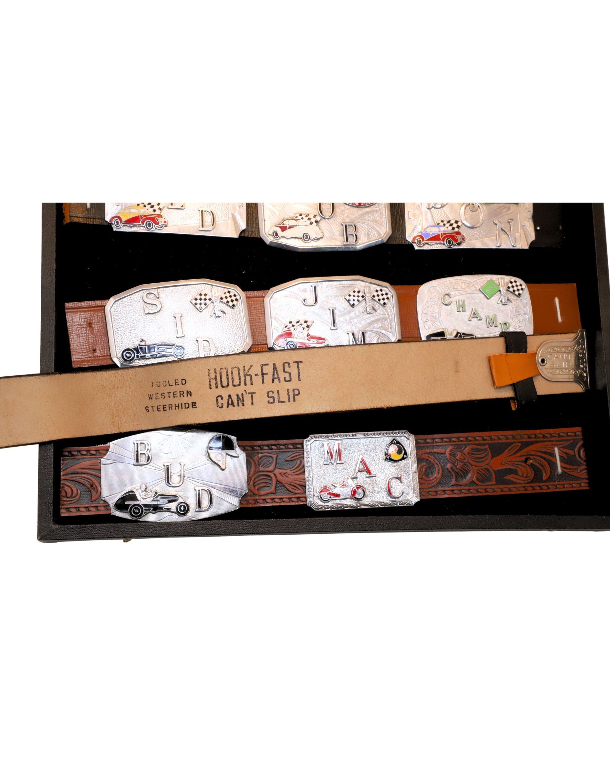 Detailed view of leather belts and personalized buckles.