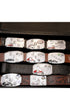 Open display of vintage Hook-Fast belt buckles.
