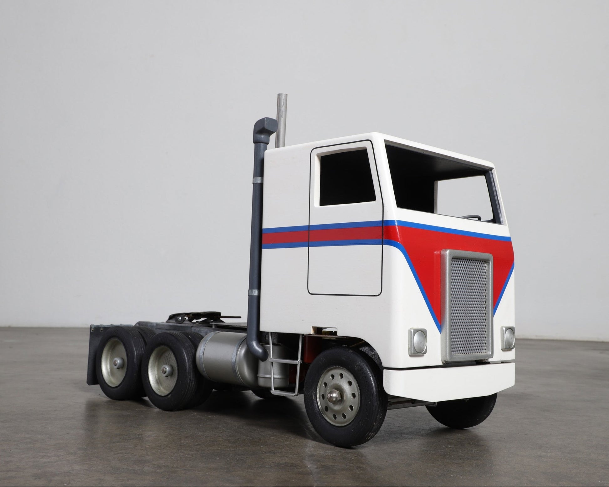  Close-up of articulated tractor and rubber wheels.