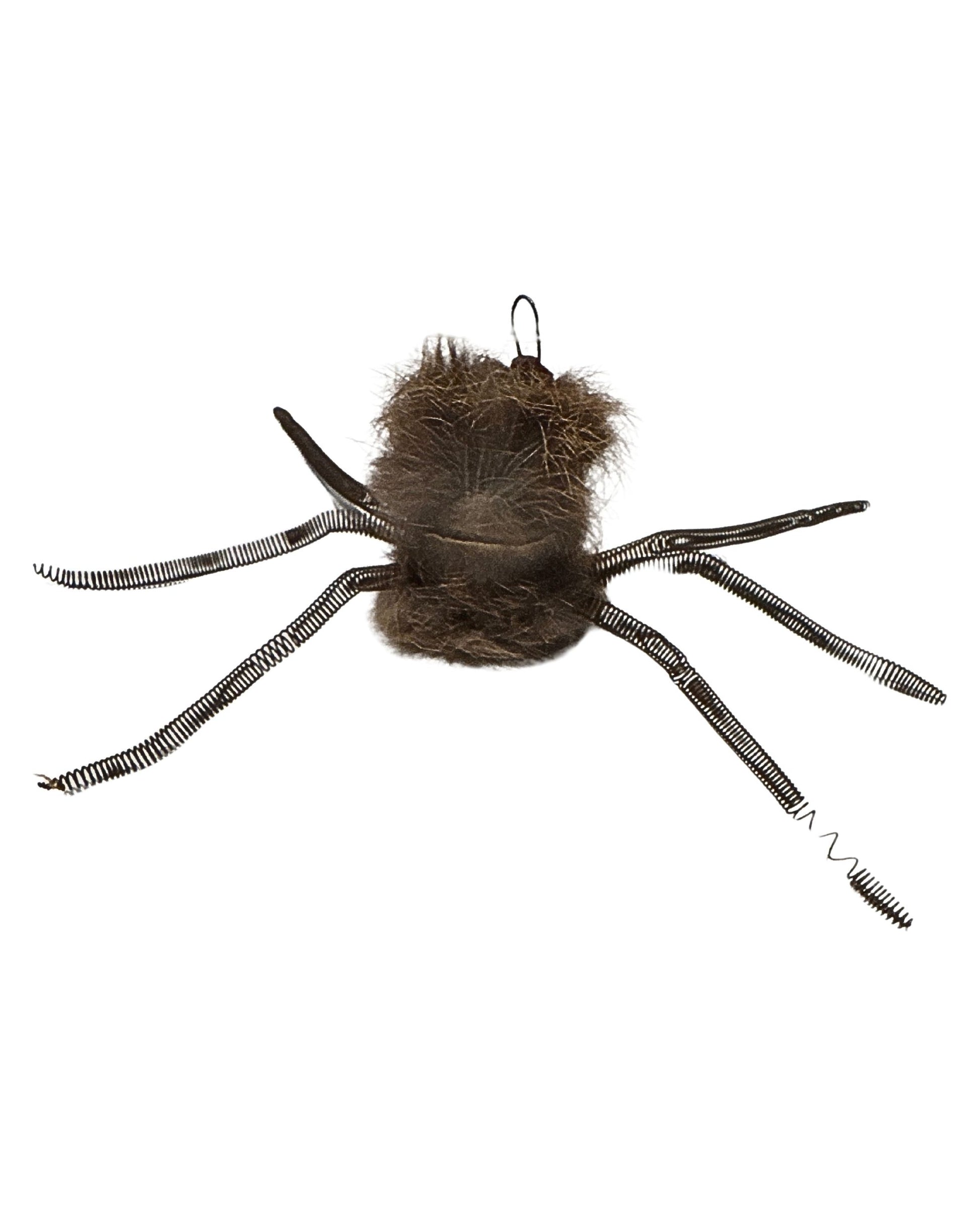 Back view of mixed media spider-shaped decoration attributed to 1946 horror era, showing fur-covered body and coiled wire legs.