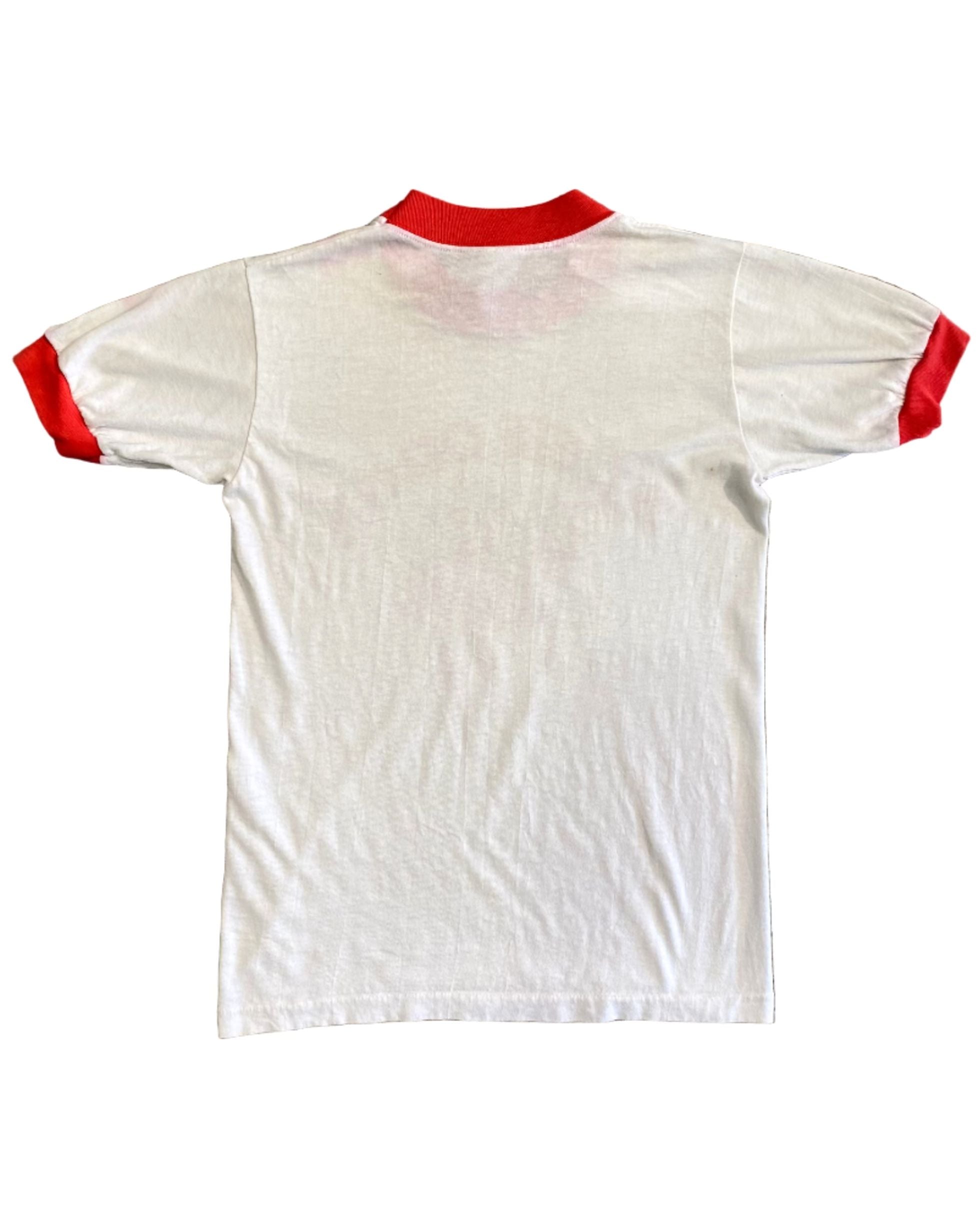 Back of white and red St. George ringer tee showing clean panel and soft wear.