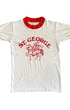 Front of white vintage 1970s St. George ringer T-shirt with red text and red trim.
