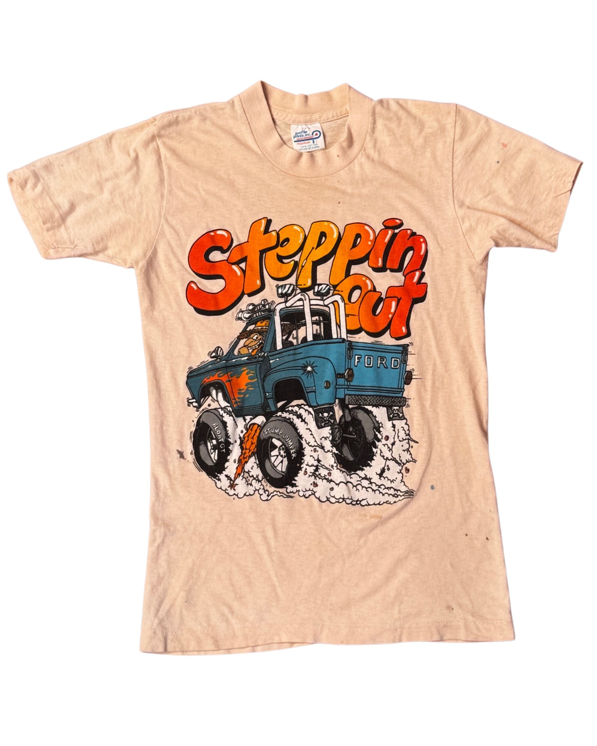 Front view of 1970s vintage Ford pickup graphic T-shirt reading “Steppin’ Out.”