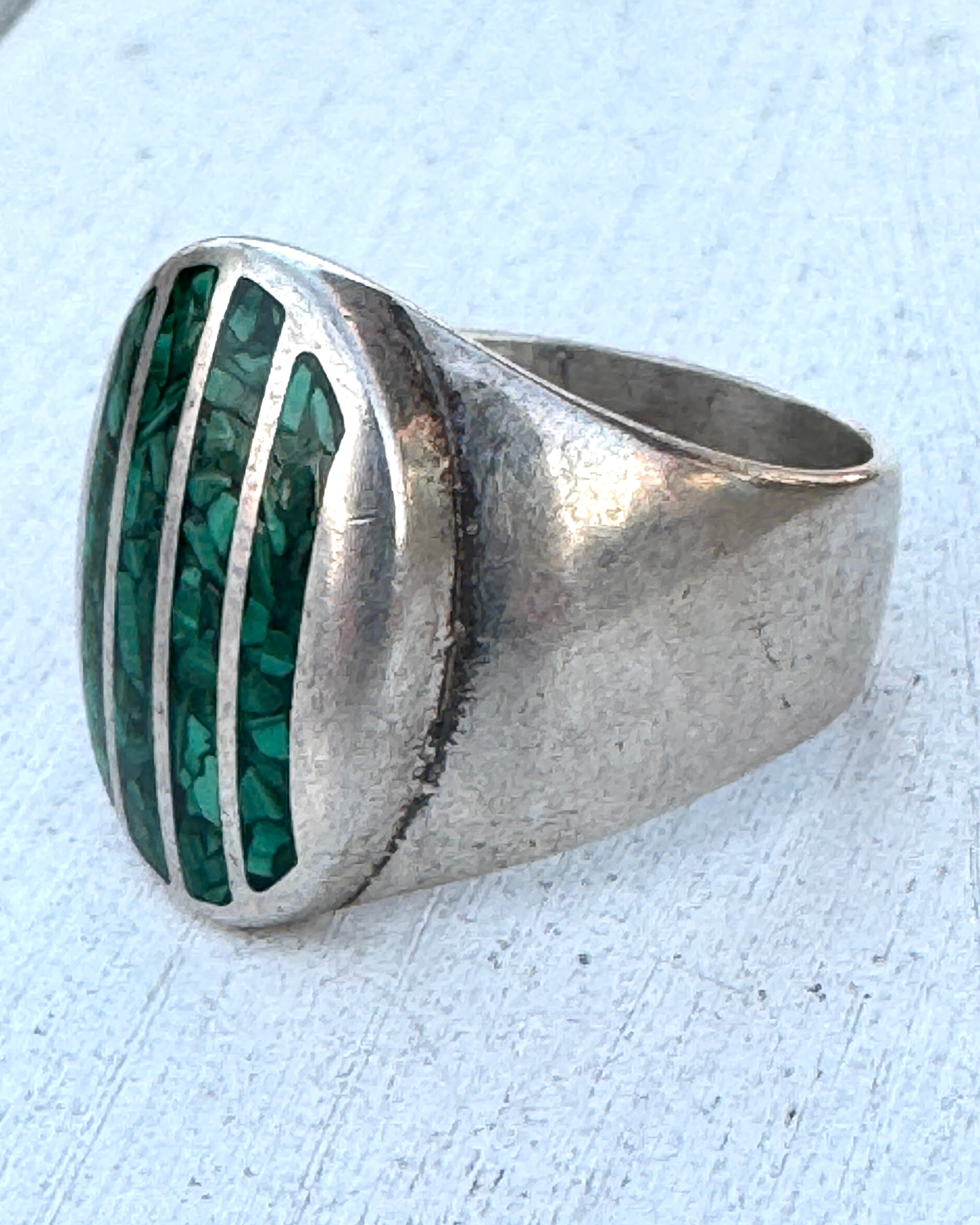 Side view of vintage sterling silver turquoise inlay ring with tapered shank.