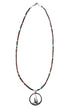 Sterling silver sailboat pendant on 21-inch vintage brown shell heishi bead necklace with turquoise highlights.