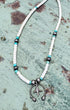 Sterling silver naja-style pendant necklace with turquoise and white Santo Domingo Pueblo beads.