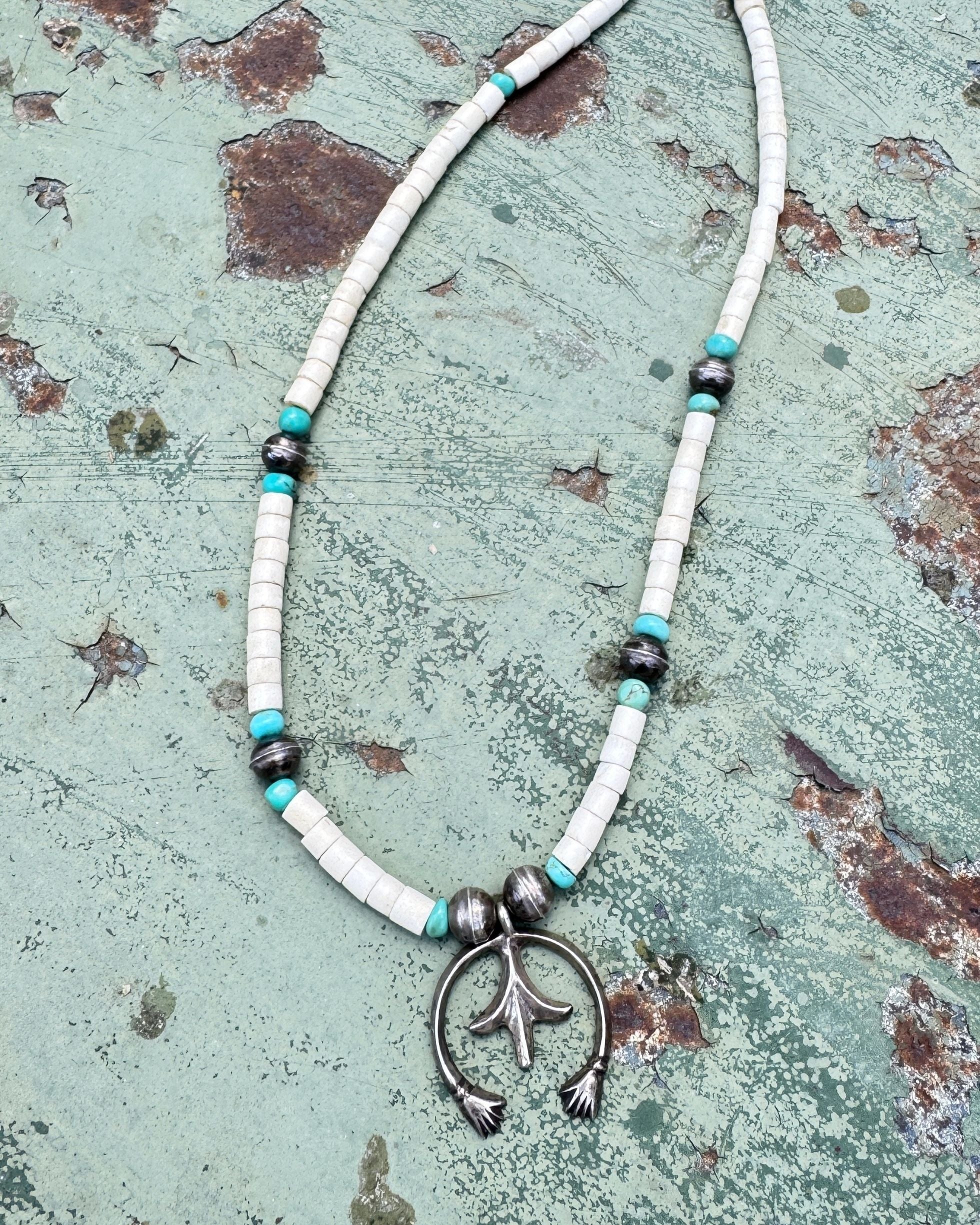 Sterling silver naja-style pendant necklace with turquoise and white Santo Domingo Pueblo beads.
