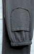 Back pocket with matching crosshatch fabric and tonal stitching.
