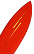 Close-up of yellow Lightning Bolt graphic against saturated red surfboard finish.