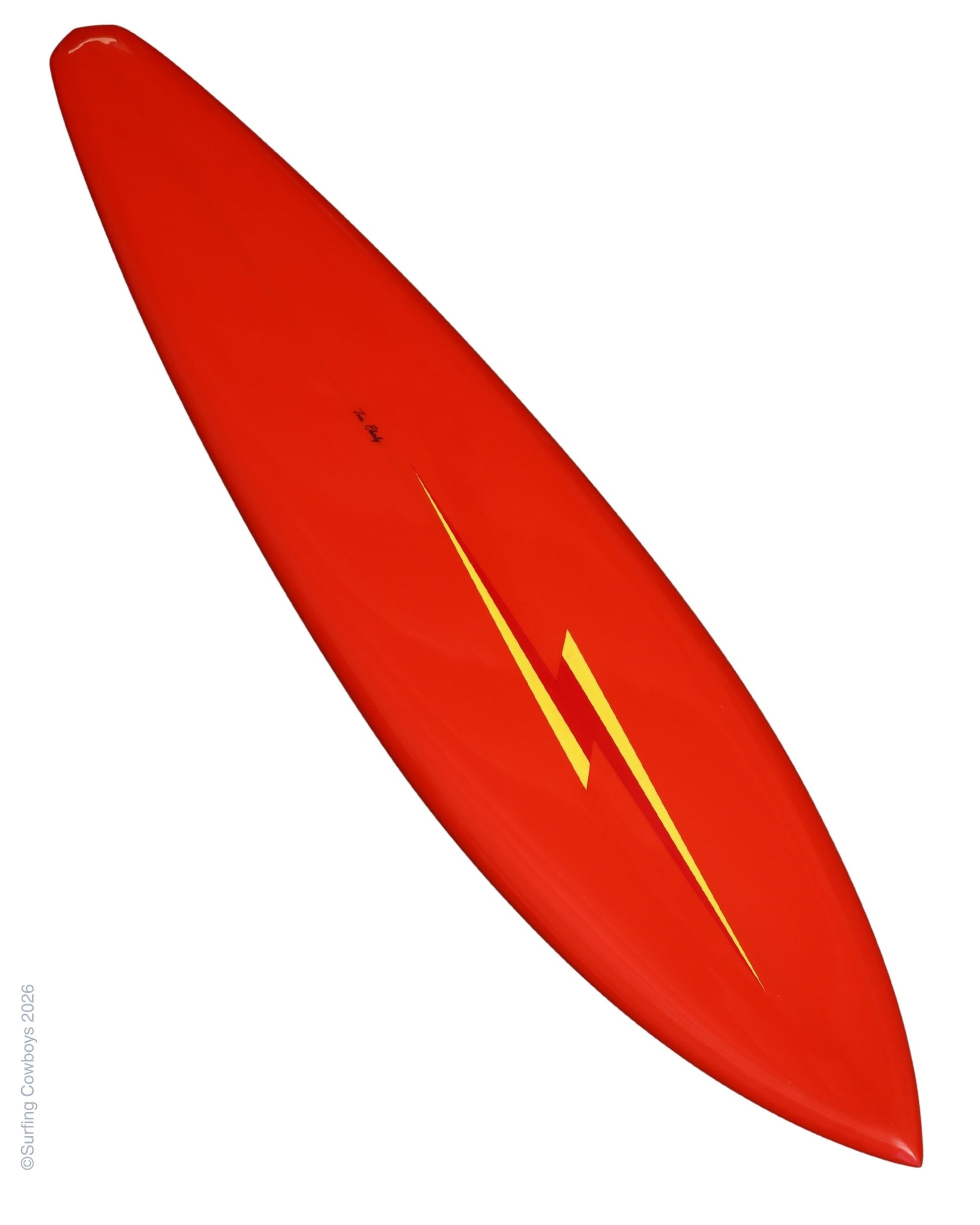 Full-length view of vintage red Lightning Bolt surfboard with yellow bolt graphic.