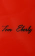 Tom Eberly hand-scripted signature on vintage Lightning Bolt surfboard.