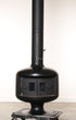 Black metal stove with chimney on a white background
