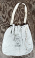 Front view of Surfing Cowboys Demons tote bag with cinch closure.