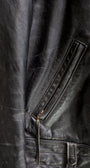 Pocket zip detail 1950s Taubers black horsehide leather jacket with lace-up sides, Western-inspired yoke, and visible signs of wear.
