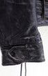 cuff and snap detail 1950s Taubers black horsehide leather jacket with lace-up sides, Western-inspired yoke, and visible signs of wear.
