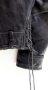 Lace up detail 1950s Taubers black horsehide leather jacket with lace-up sides, Western-inspired yoke, and visible signs of wear.
