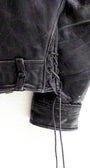 Lace up detail 1950s Taubers black horsehide leather jacket with lace-up sides, Western-inspired yoke, and visible signs of wear.
