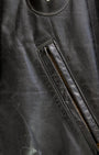 Pocket detail: 1950s Taubers black horsehide leather jacket with lace-up sides, Western-inspired yoke, and visible signs of wear.