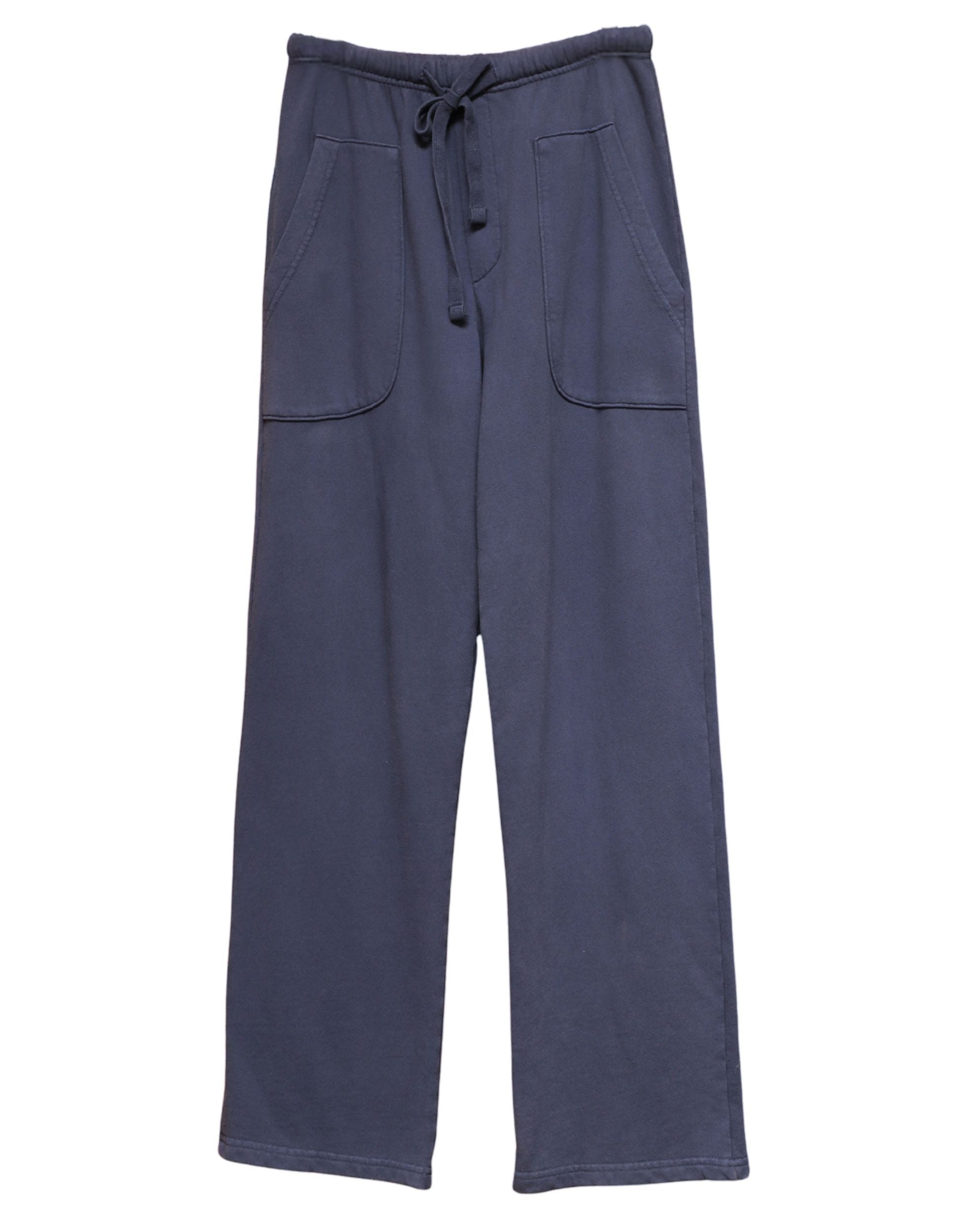 Flat lay of Surfing Cowboys Weekender Pants in washed navy with front patch pockets.