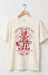 Cream Surfing Cowboys Tiki-Rock Malibu T-shirt with bold red tiki figure and vintage-style guitar graphic.