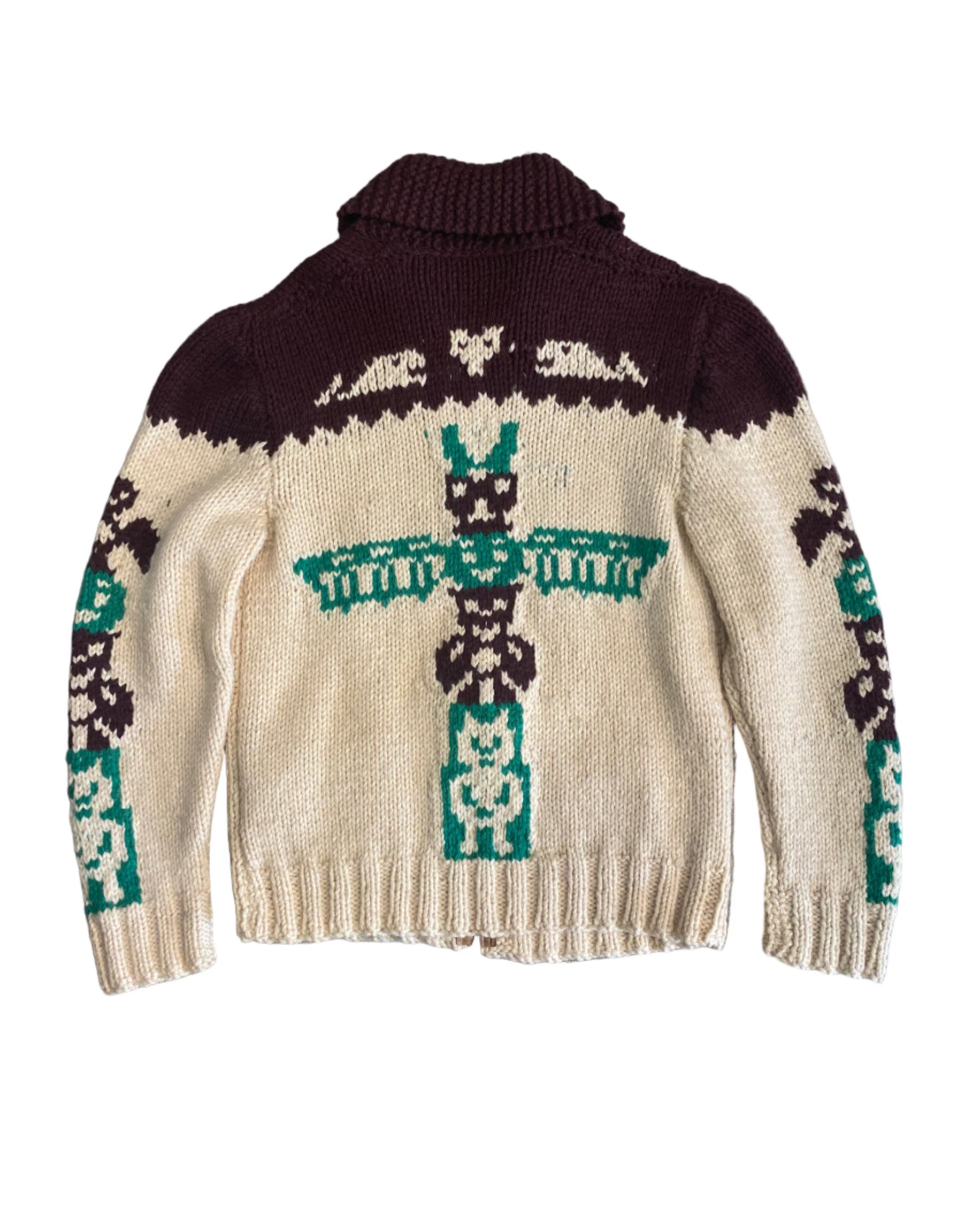 Back view of 1970s handmade wool cardigan featuring bold totem pole motif.
