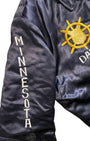 Embroidered Minnesota sleeve detail on black satin military tour jacket.