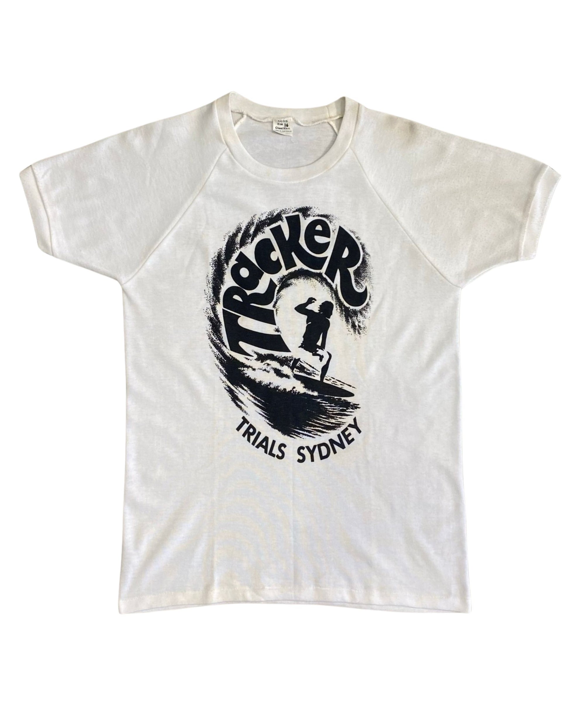 Front of 1970s Tracker Trials Sydney surf T-shirt with black wave and surfer graphic.
