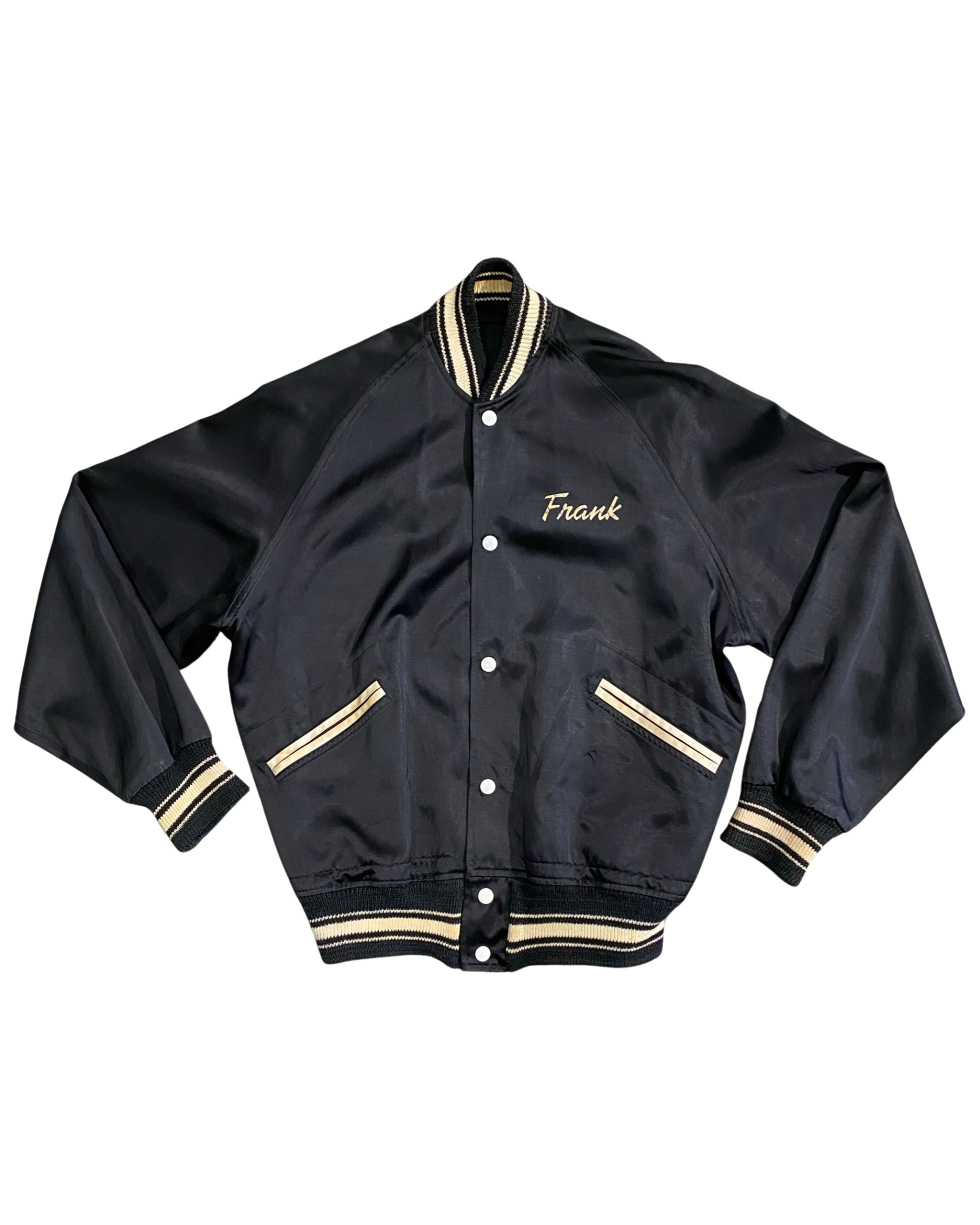 Vintage 1940s black satin Pearl Harbor apprentice jacket with silk screened back and “Frank” on front. Made in Honolulu, Hawaii. Front of Jacket.