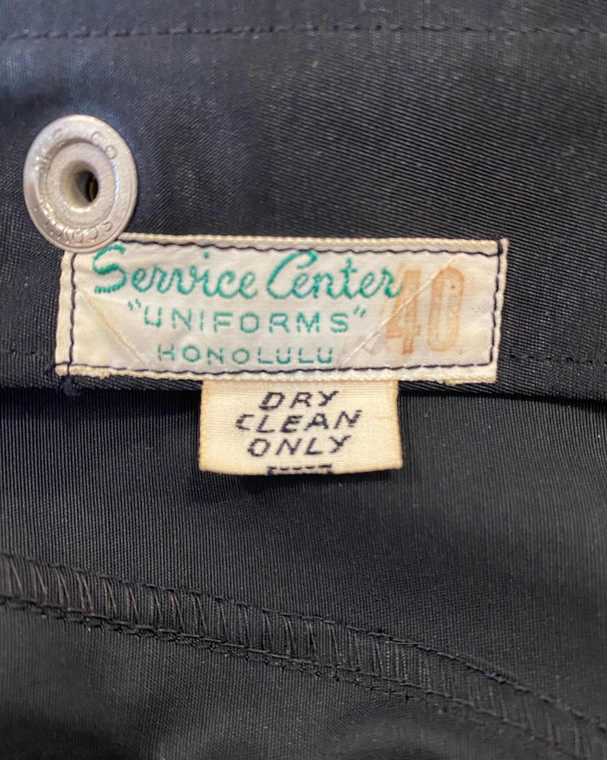 Vintage 1940s black satin Pearl Harbor apprentice jacket with silk screened back and “Frank” on front. Made in Honolulu, Hawaii. Service Center Uniforms Honolulu  and Dry Clean Only Label.