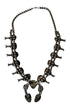 Reverse side of 1950s turquoise squash blossom necklace with sterling Naja pendant and natural matrix stones.