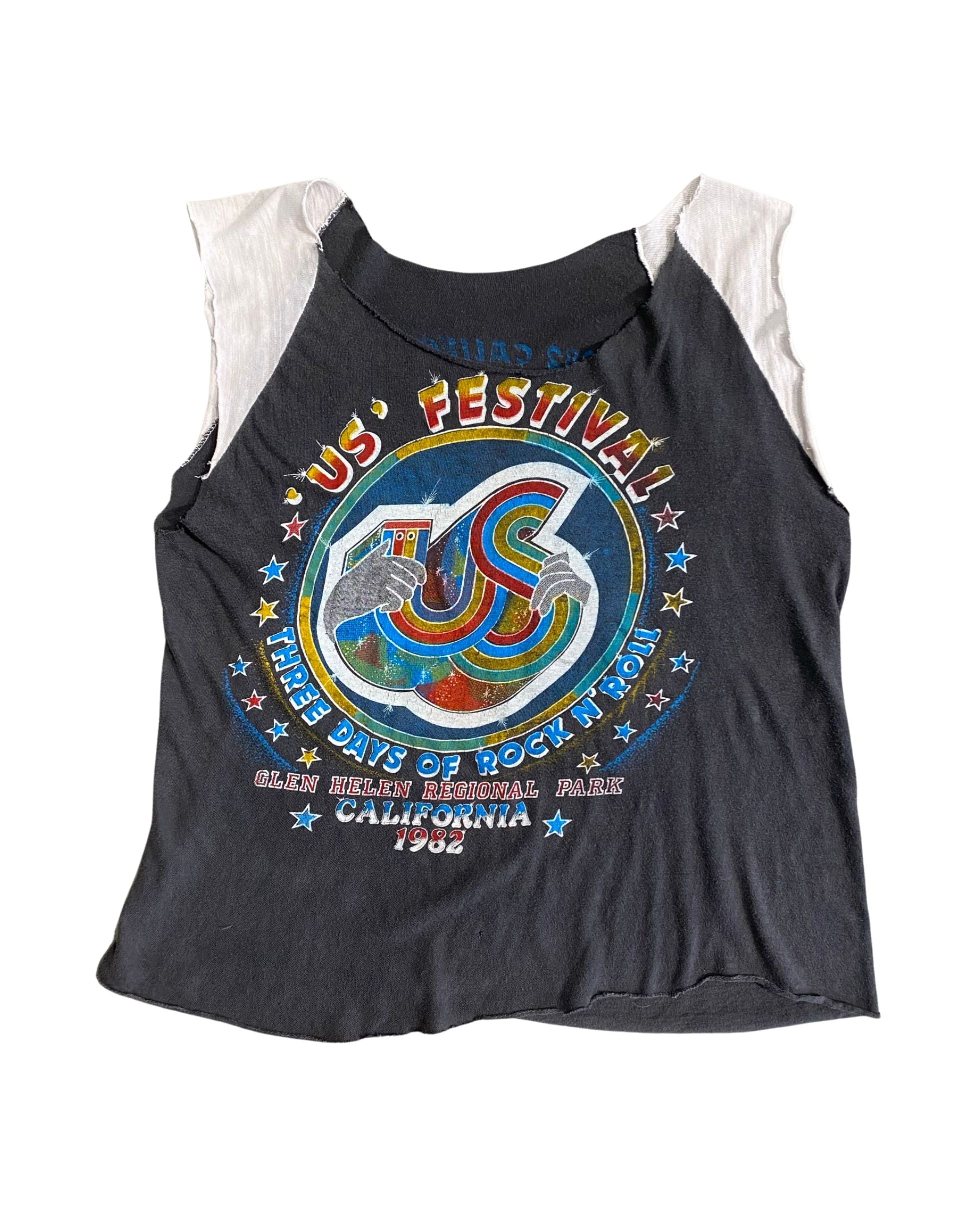 Front view of 1982 US Festival vintage concert T-shirt with bold graphic and cropped sleeves.

