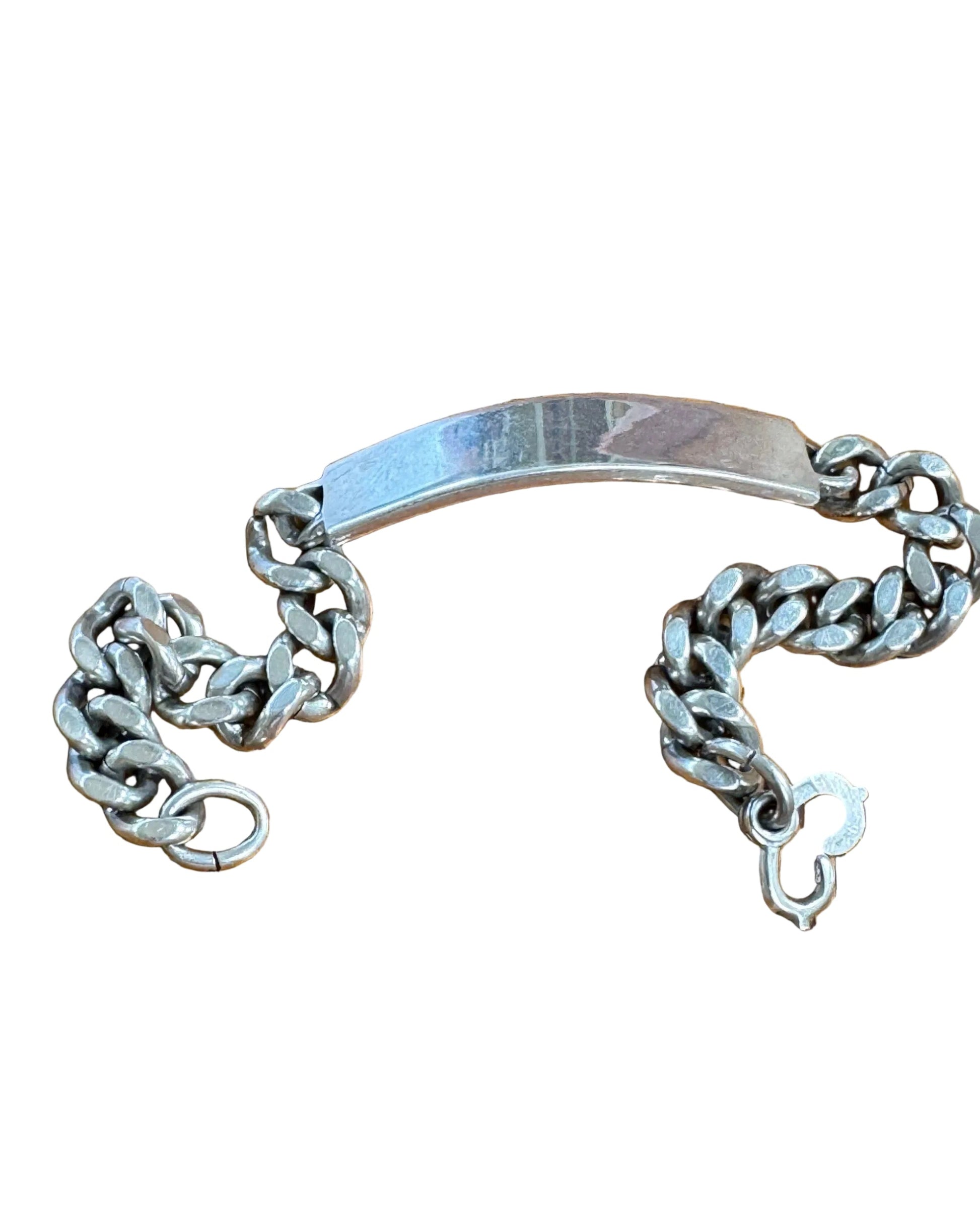 Vintage 1940s sterling silver WWII ID bracelet. Un-engraved faceplate with original clasp.