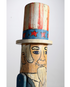 The upclose side view of the Uncle Sam Barbershop Pole Art Sculpture, c. 1960s.