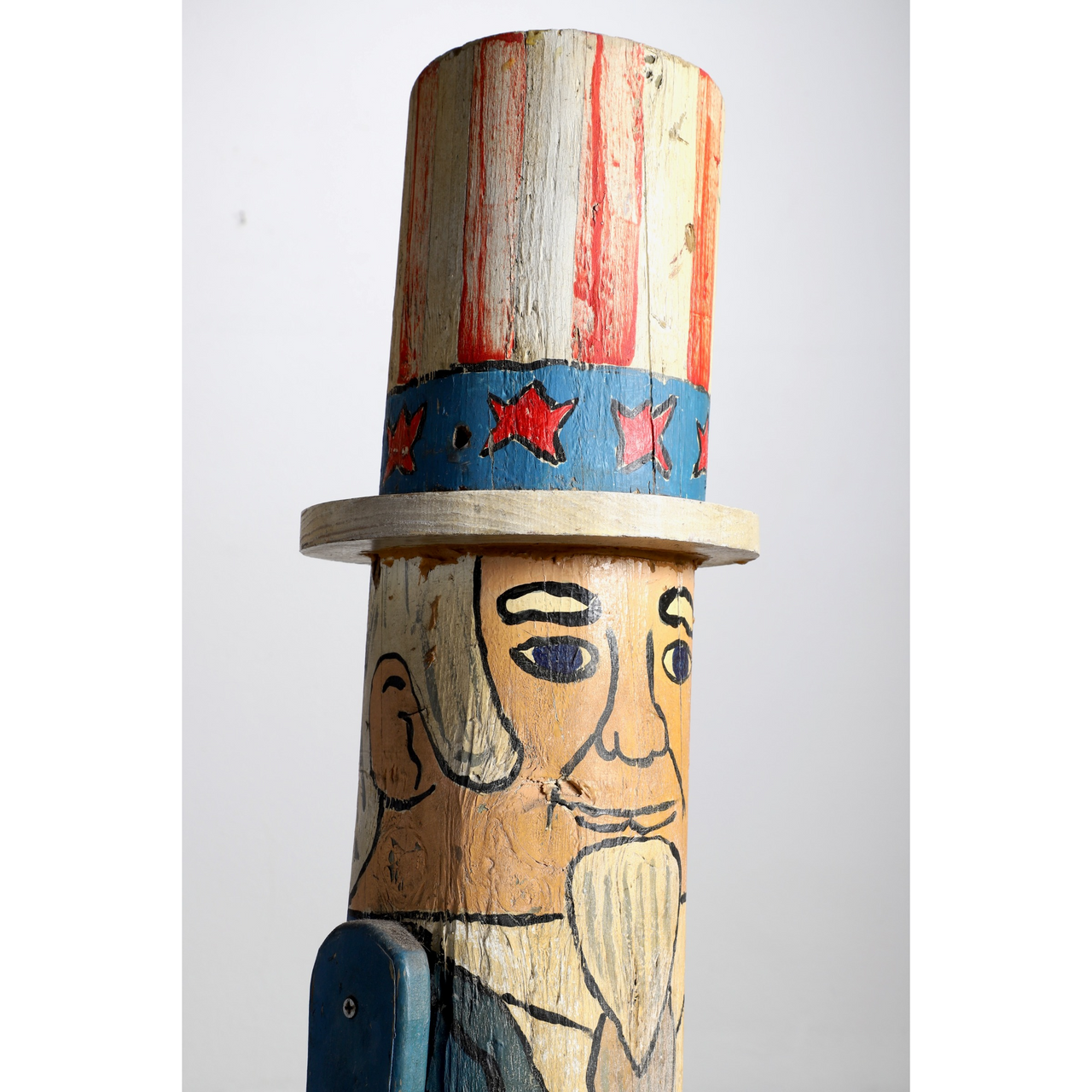 The upclose side view of the Uncle Sam Barbershop Pole Art Sculpture, c. 1960s.