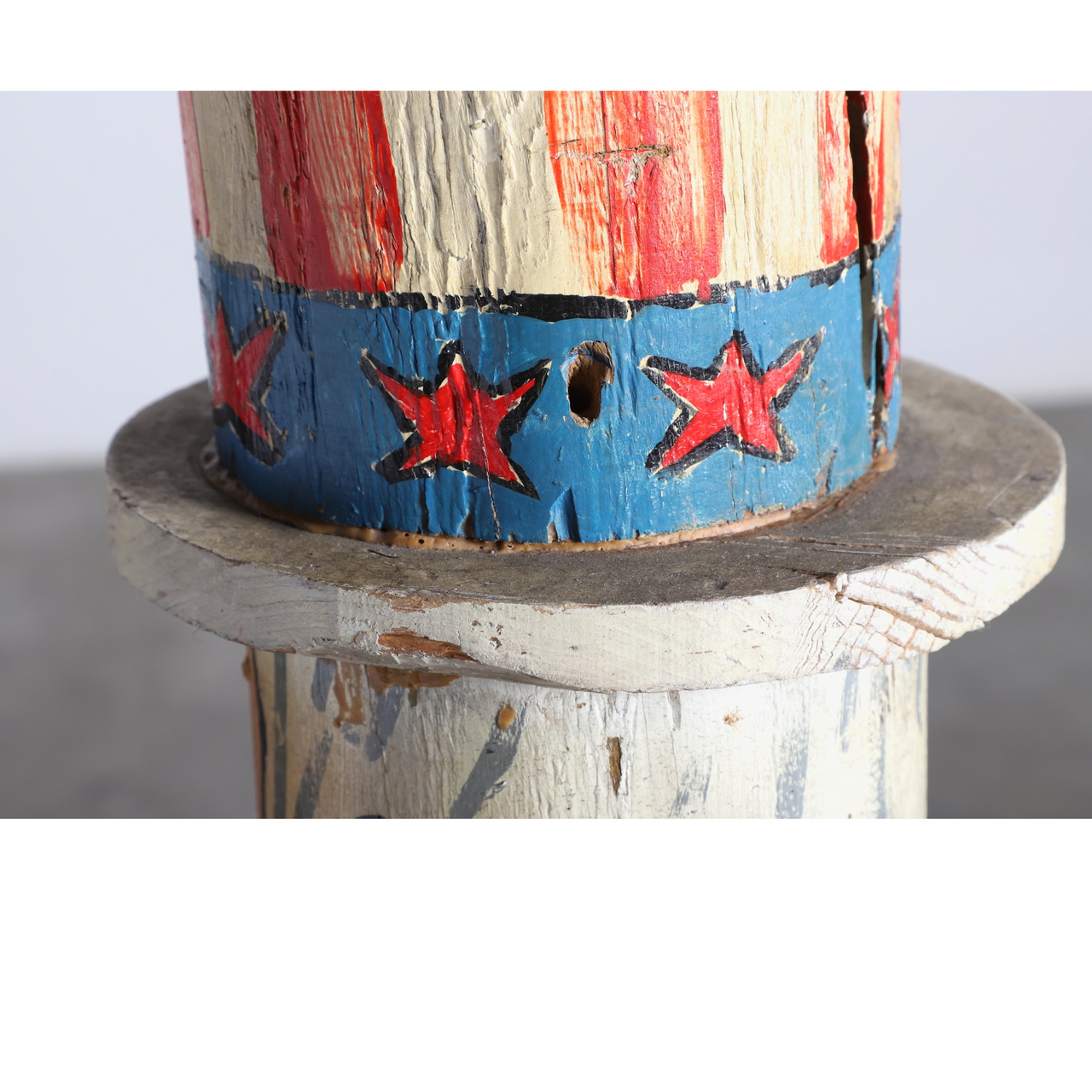 The upclose view of the hat on the Uncle Sam Barbershop Pole Art Sculpture, c. 1960s.