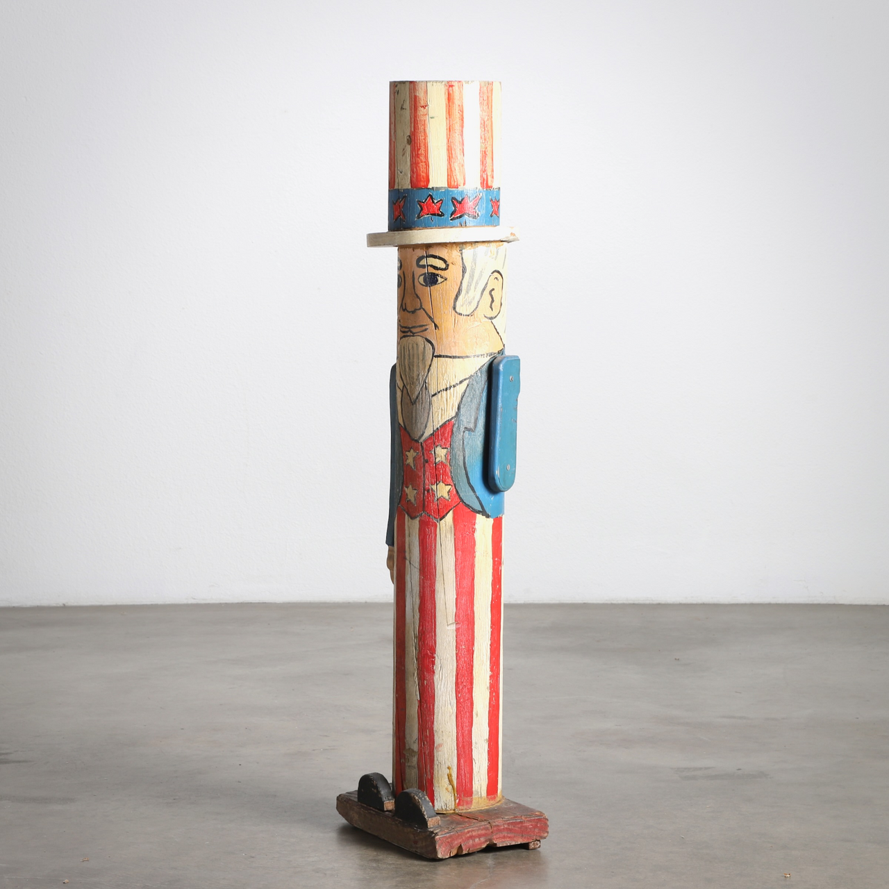 The full side view of the Uncle Sam Barbershop Pole Art Sculpture, c. 1960s.