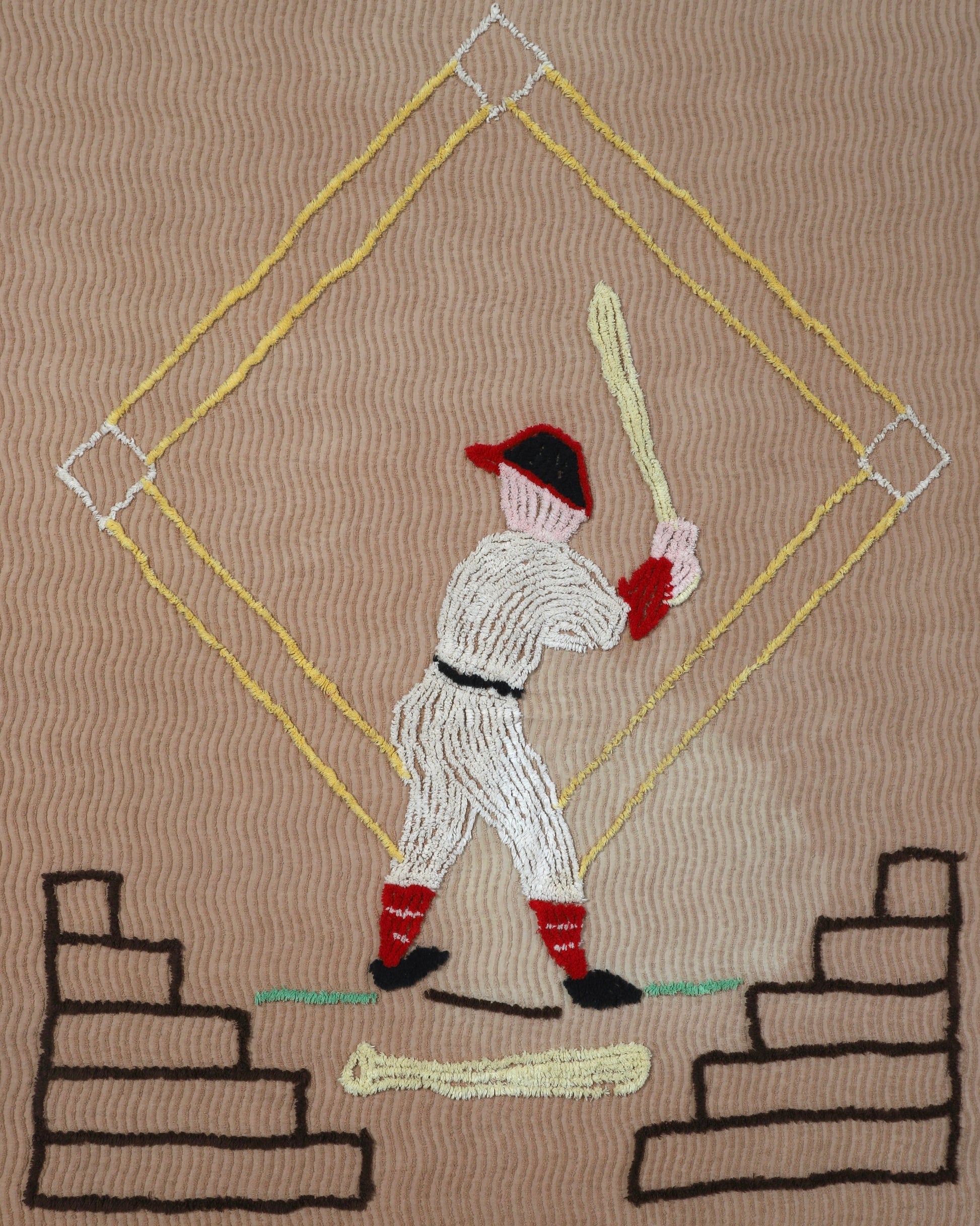  Close-up of vintage 1950s chenille bedspread with baseball motif.