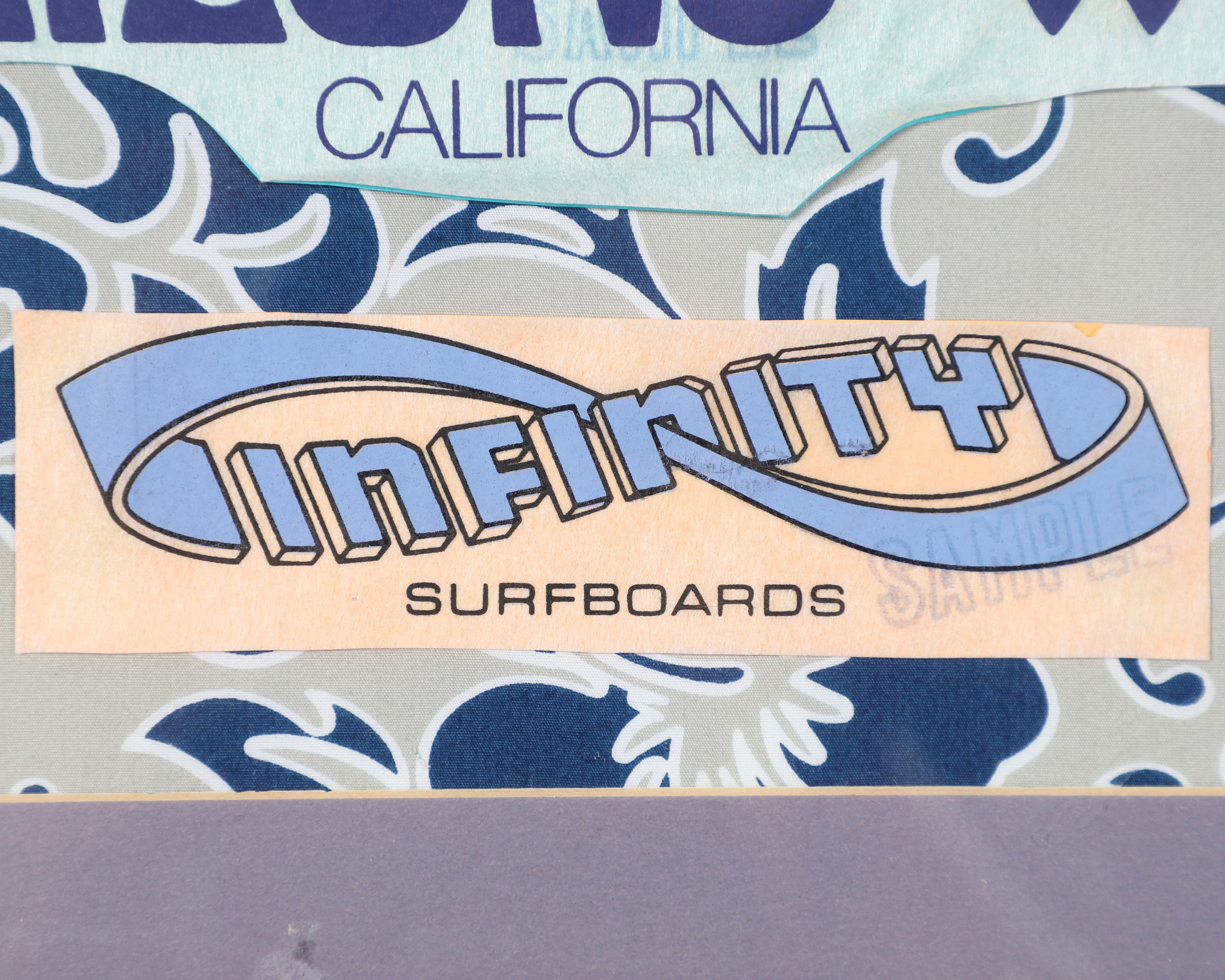 Vintage Surfboard Laminate Collection in Frame Close Up Logo