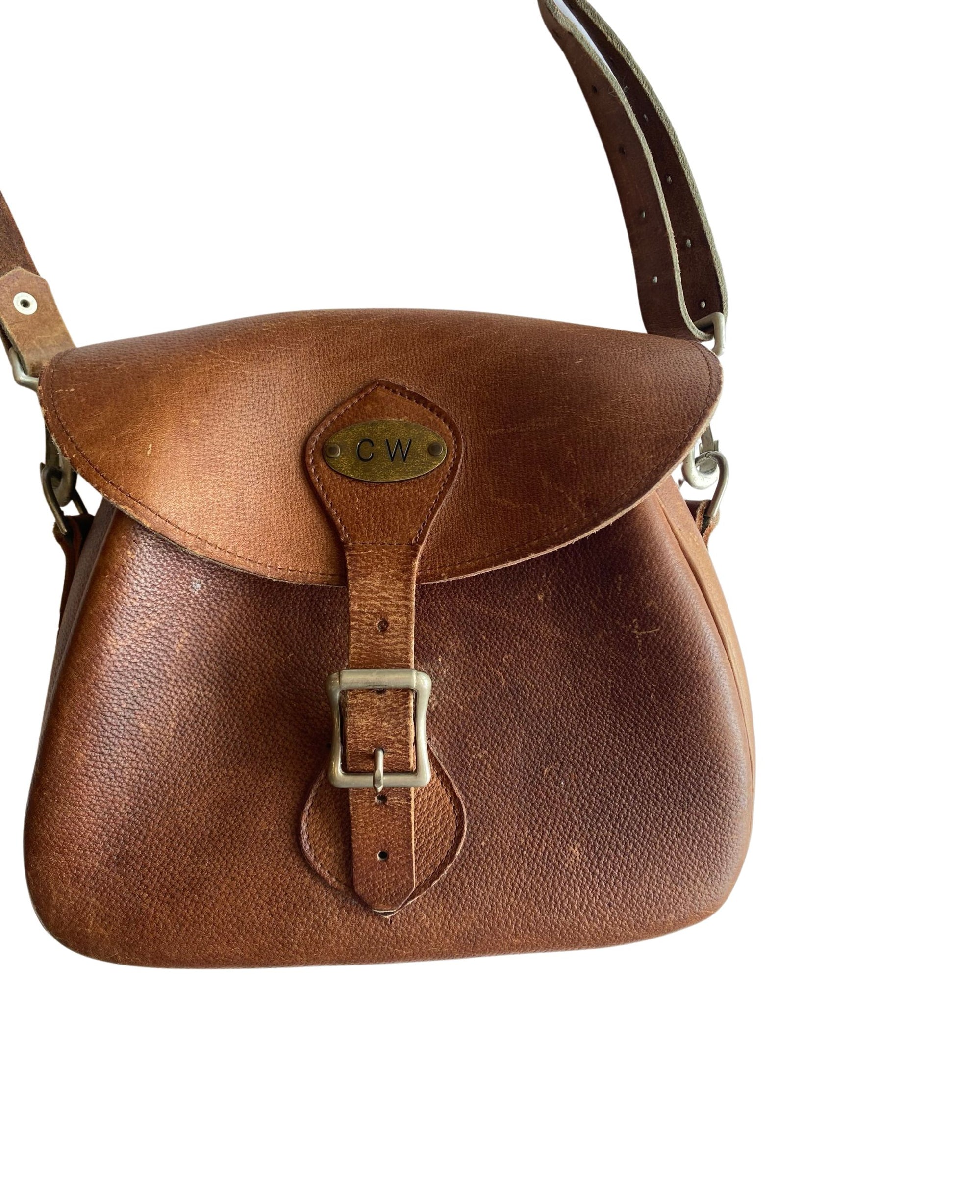 Close-up of brass CW monogram plate and buckle.